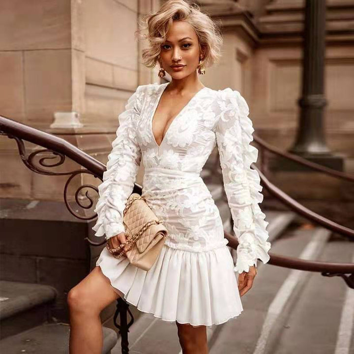 Damer Elegant kortærmet minikjole med blomsterprint og flæsedetaljer Stilla