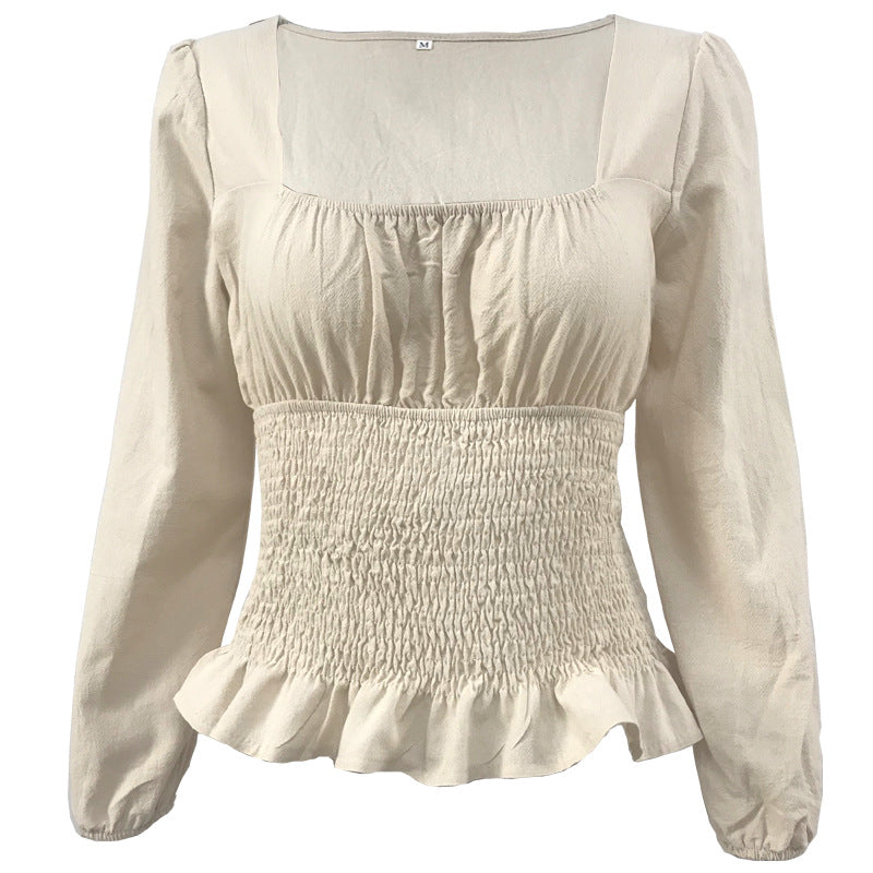 Damebluse med elastisk nederkant og fine flæsedetaljer Stilla