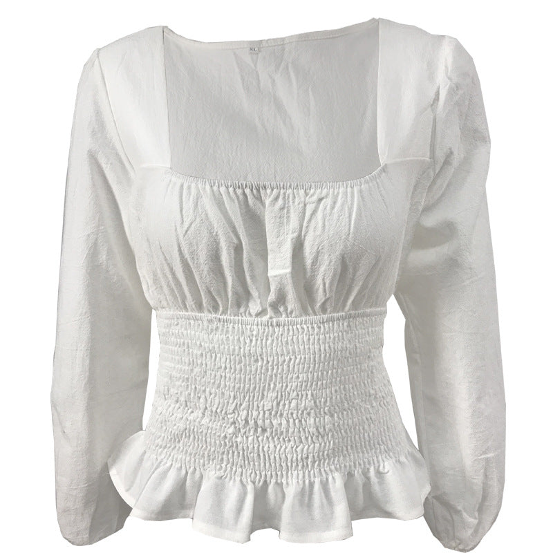 Damebluse med elastisk nederkant og fine flæsedetaljer Stilla