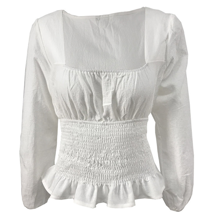 Damebluse med elastisk nederkant og fine flæsedetaljer Stilla