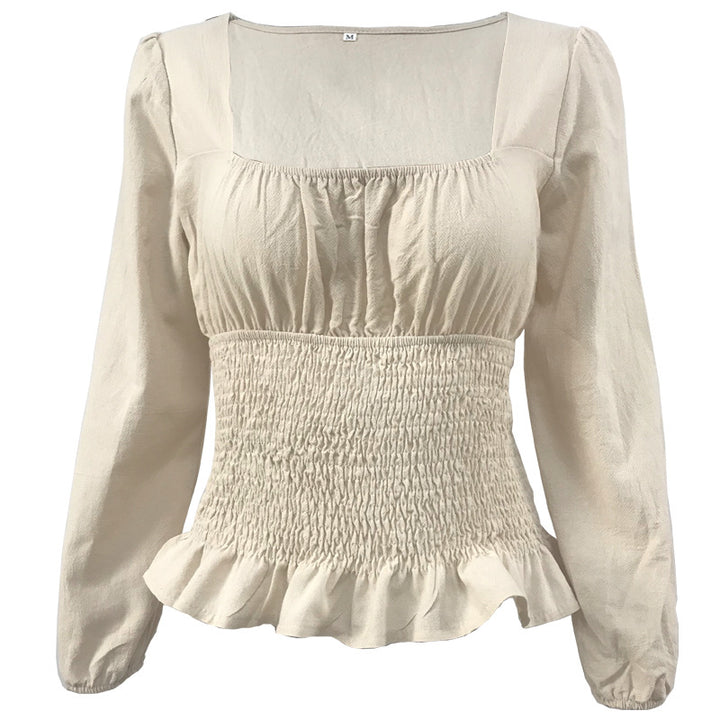 Damebluse med elastisk nederkant og fine flæsedetaljer Stilla