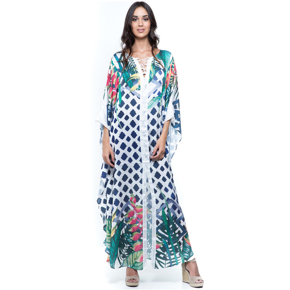 Dame Strandkaftan med farverigt blomstertryk og luftig silhuet Stilla