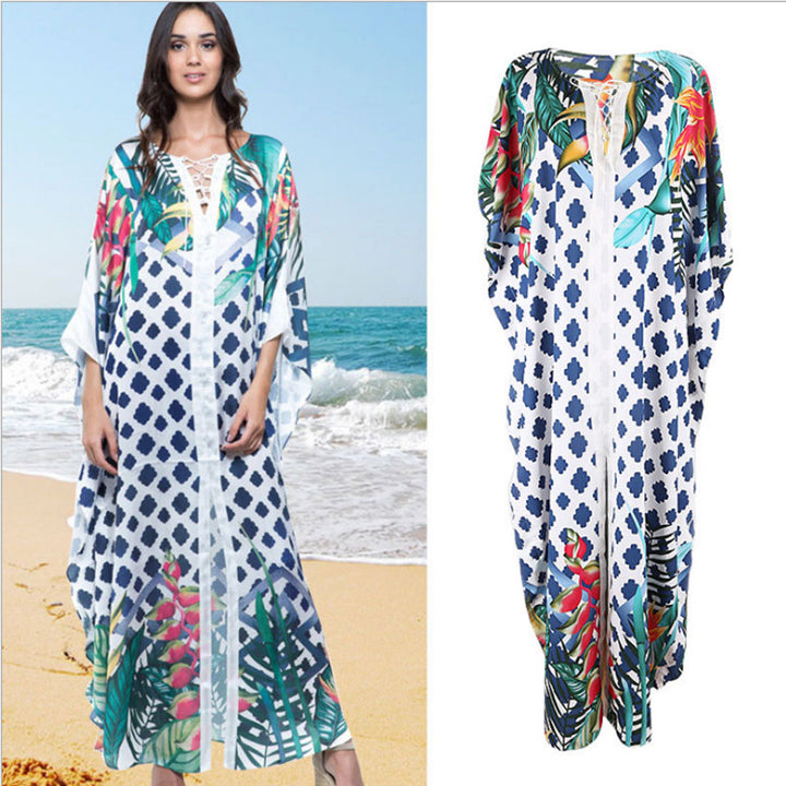 Dame Strandkaftan med farverigt blomstertryk og luftig silhuet Stilla