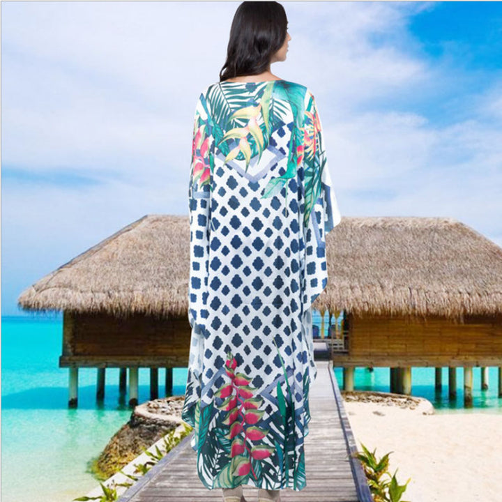 Dame Strandkaftan med farverigt blomstertryk og luftig silhuet Stilla