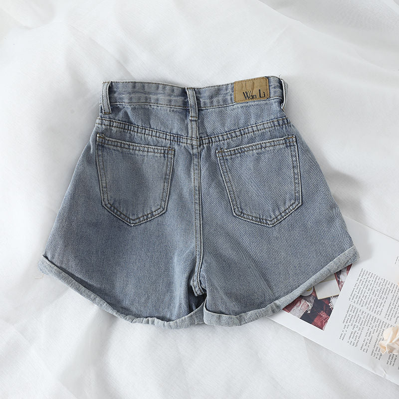 Kvinders højtaljede denimshorts med omskiftelig kant og elastisk talje Skovae