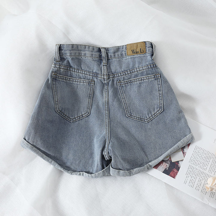 Kvinders højtaljede denimshorts med omskiftelig kant og elastisk talje Skovae