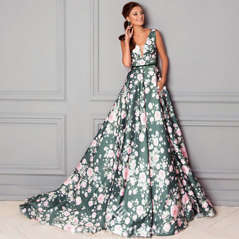 Dame maxikjole med elegant floral print og svingende kant Stilla