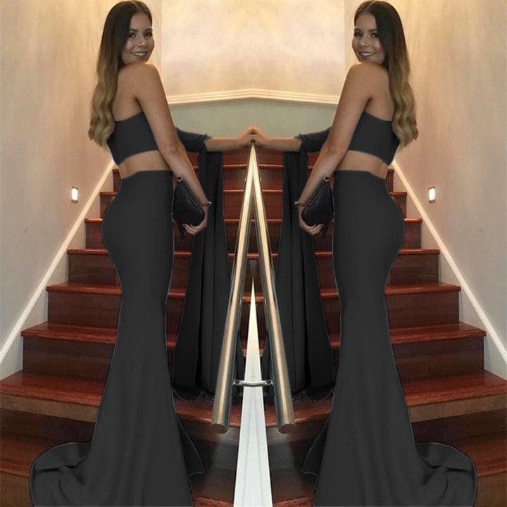 Kvinders elegante off-the-shoulder aftenkjole med asymmetrisk snit og flydende stof