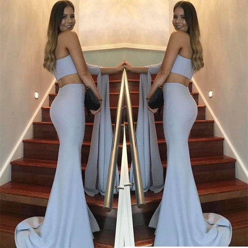 Kvinders elegante off-the-shoulder aftenkjole med asymmetrisk snit og flydende stof