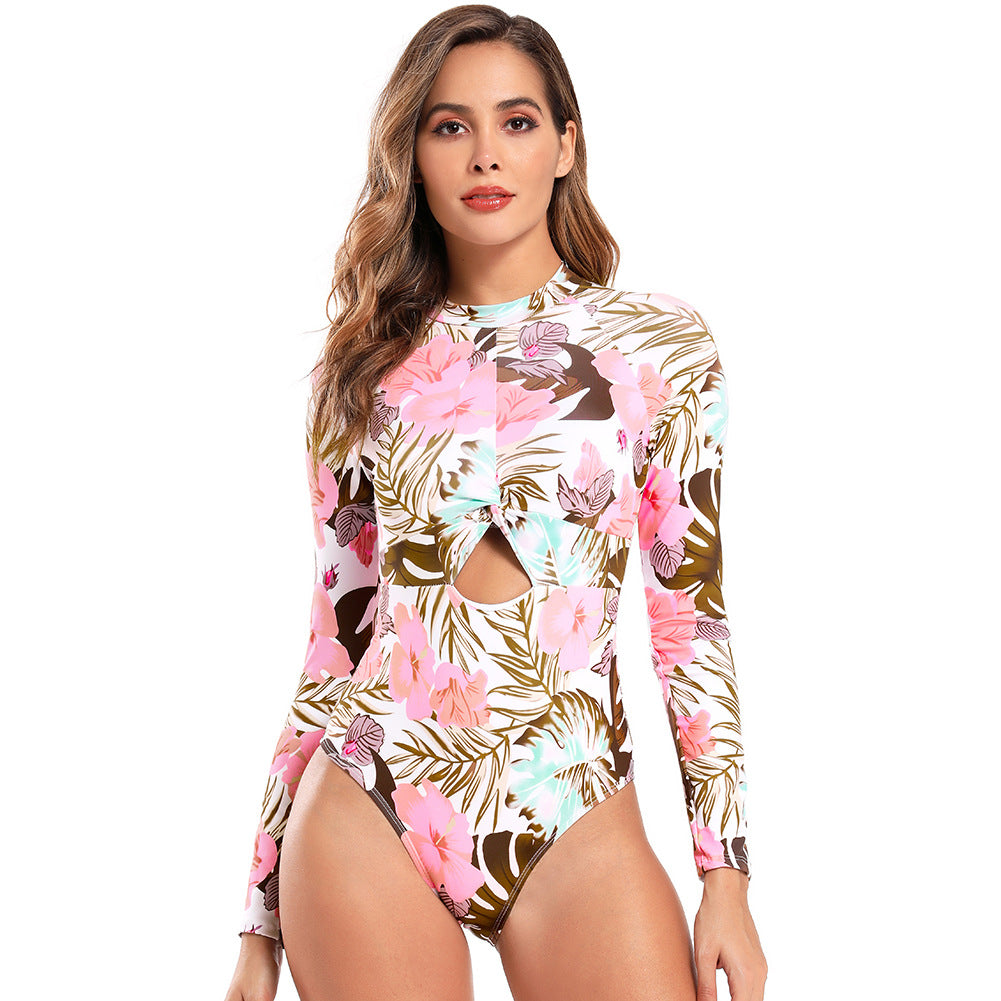 Dame Én-dels badedragt med moderne cut-out og blomstermønster Stilla