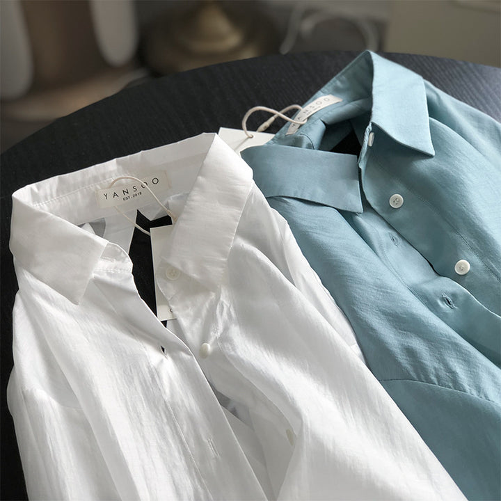Dame Oversize-bluse med unikt rygdetalje og justerbar bund Stilla