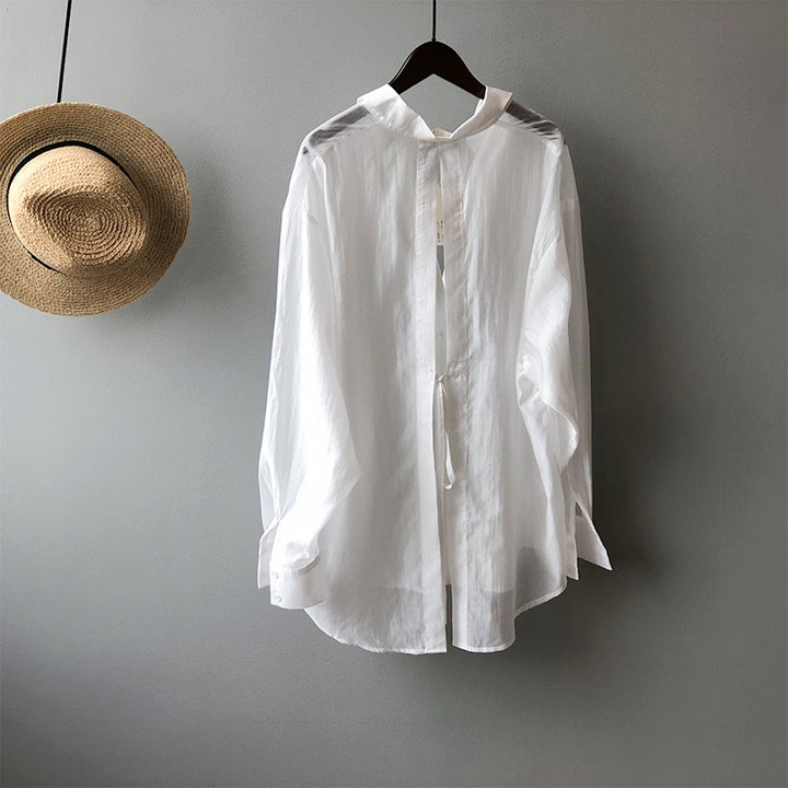 Dame Oversize-bluse med unikt rygdetalje og justerbar bund Stilla