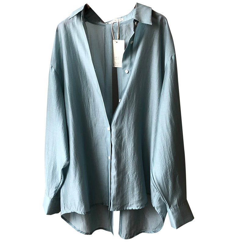 Dame Oversize-bluse med unikt rygdetalje og justerbar bund Stilla