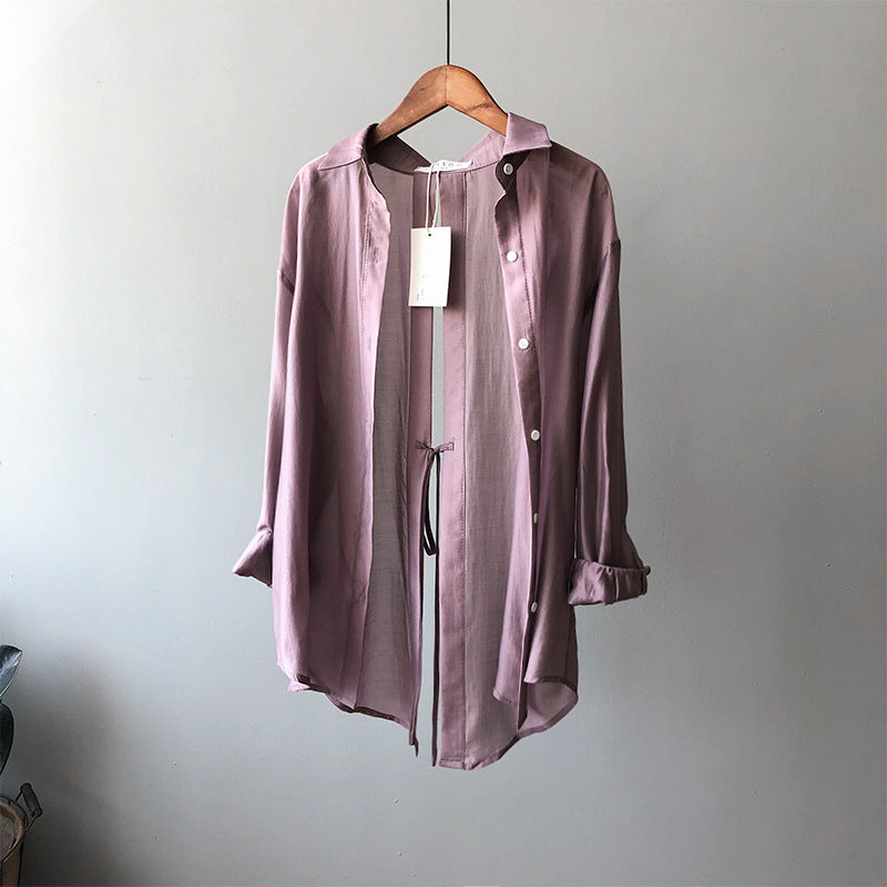 Dame Oversize-bluse med unikt rygdetalje og justerbar bund Stilla