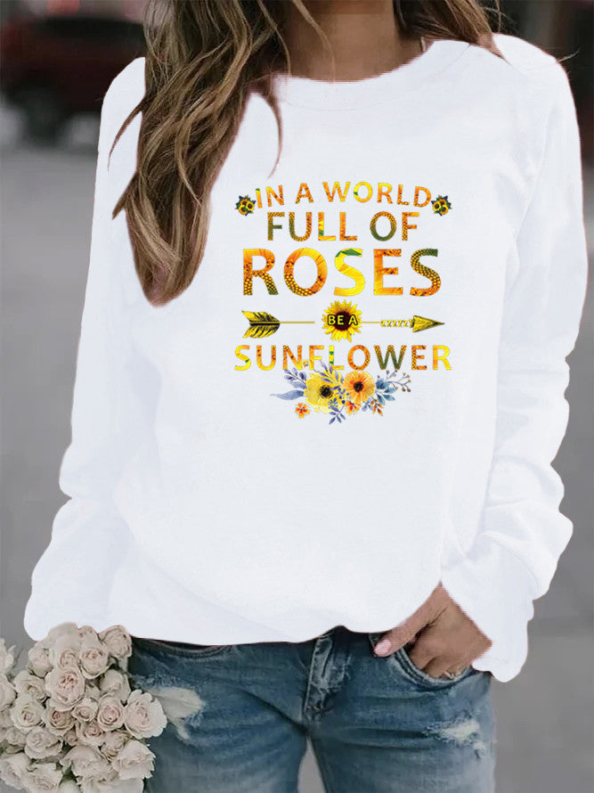 Dame sweatshirt med inspirerende design og blomsterdekoration Stilla