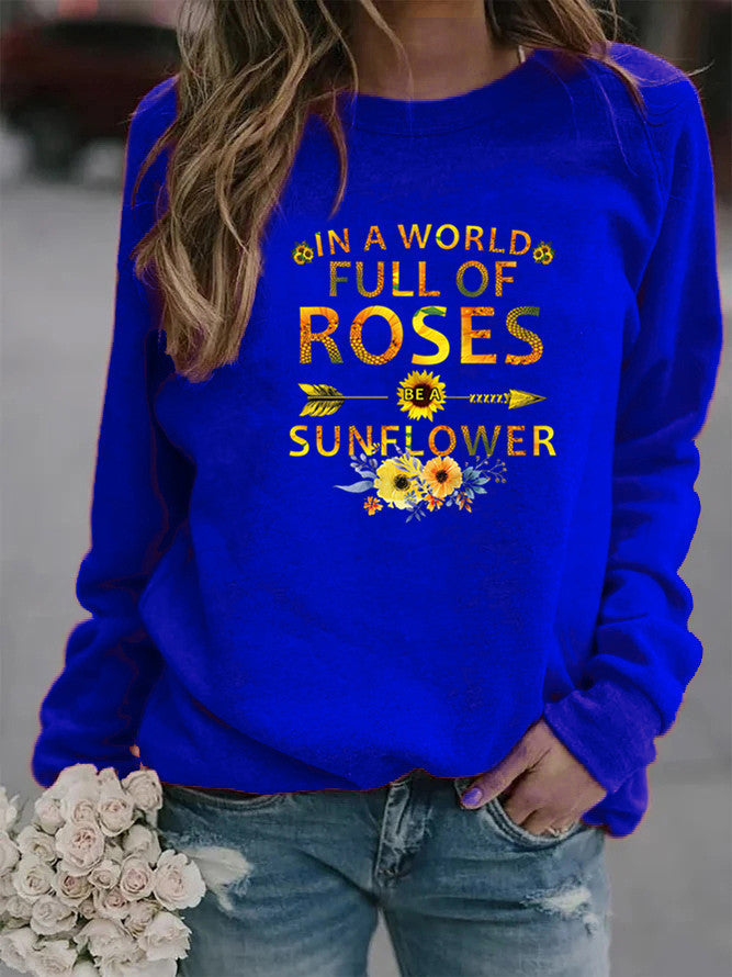 Dame sweatshirt med inspirerende design og blomsterdekoration Stilla