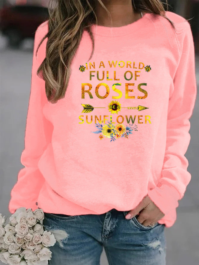 Dame sweatshirt med inspirerende design og blomsterdekoration Stilla