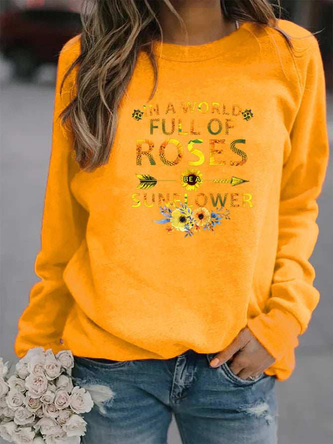 Dame sweatshirt med inspirerende design og blomsterdekoration Stilla
