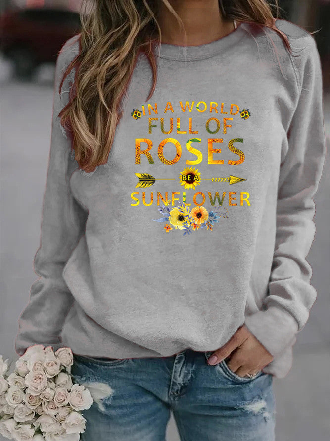 Dame sweatshirt med inspirerende design og blomsterdekoration Stilla