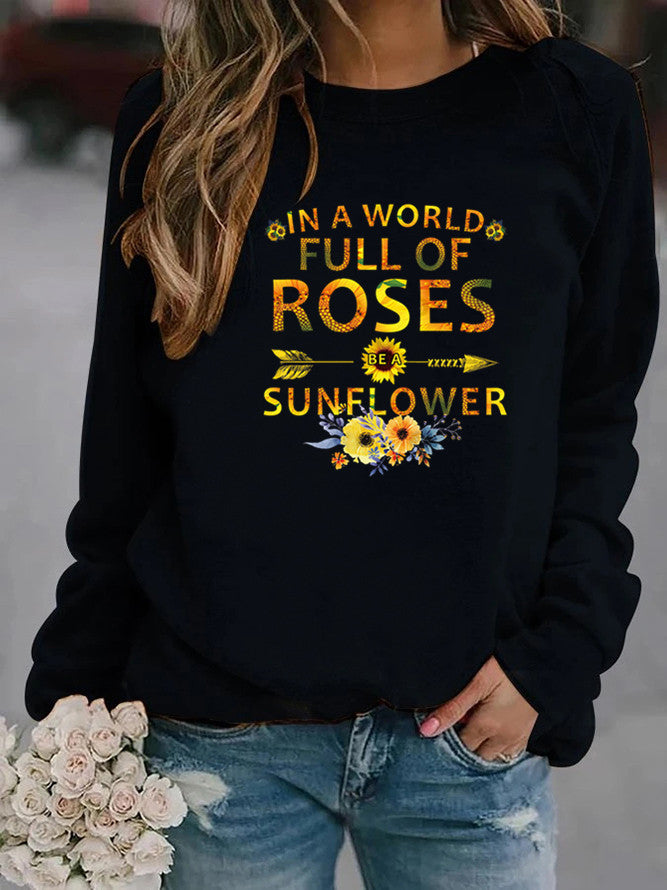 Dame sweatshirt med inspirerende design og blomsterdekoration Stilla