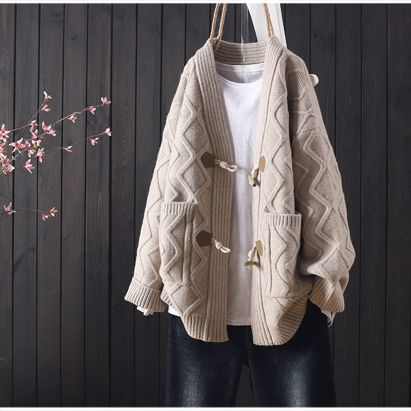 Kvinders chunky strikket cardigan med unik kabelstrikstruktur og fashionable knapdetaljer Stilla