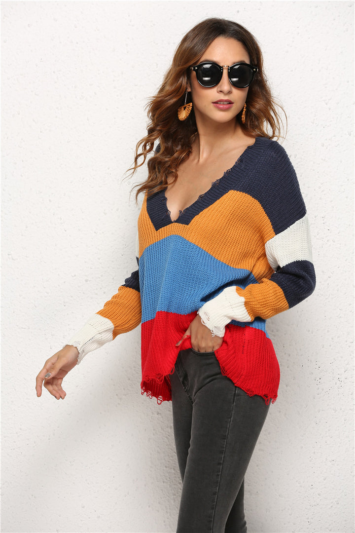 Dame afslappet strikket pullover med dyb V-hals og moderne stribet mønster Stilla