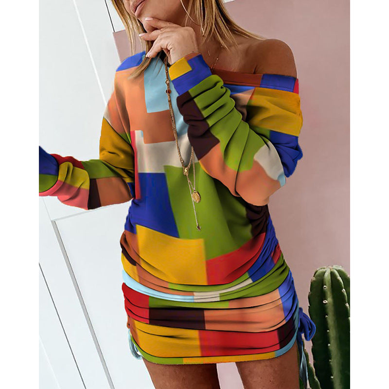 Dame kreativ minikjole med off-shoulder design og farverige blokmønstre Stilla