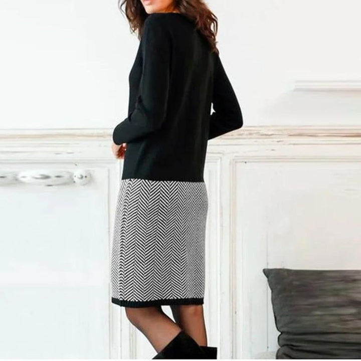 Stilla | Elegant kjole med hane-ben kant