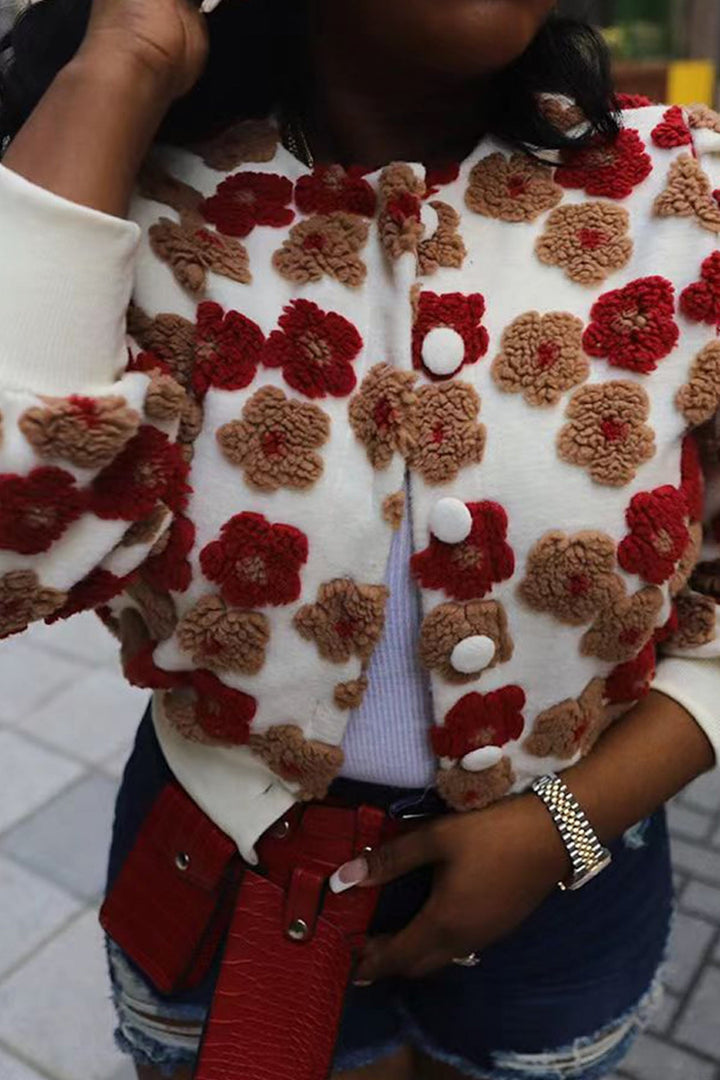 Stilla | Strikjakke med blomstrende jacquard og puffærmer
