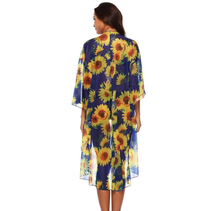 Dame transparent strandkimono med florale accenter og elegant snit Stilla