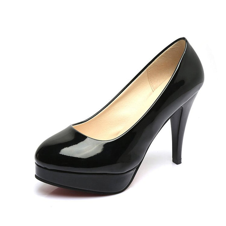 Dame Plateau-Pumps med glinsende overflade og elegant design Stilla