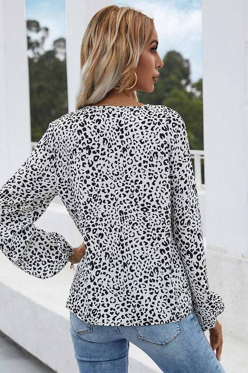 Stilla | Bluse med blomstret tryk og rynkede manschetter