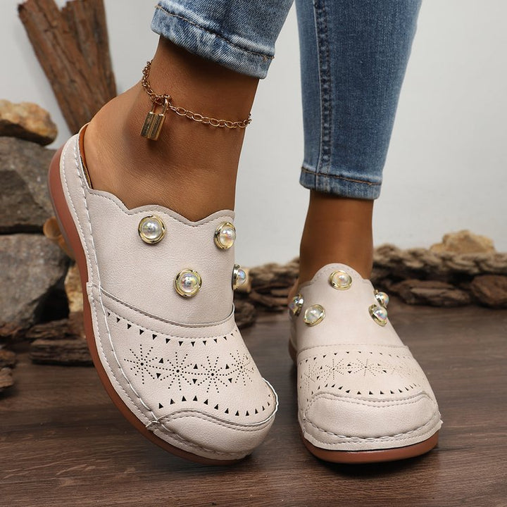 Dame Slip-On Clogs med Modeperforering og Elegante Dekordetaljer Stilla