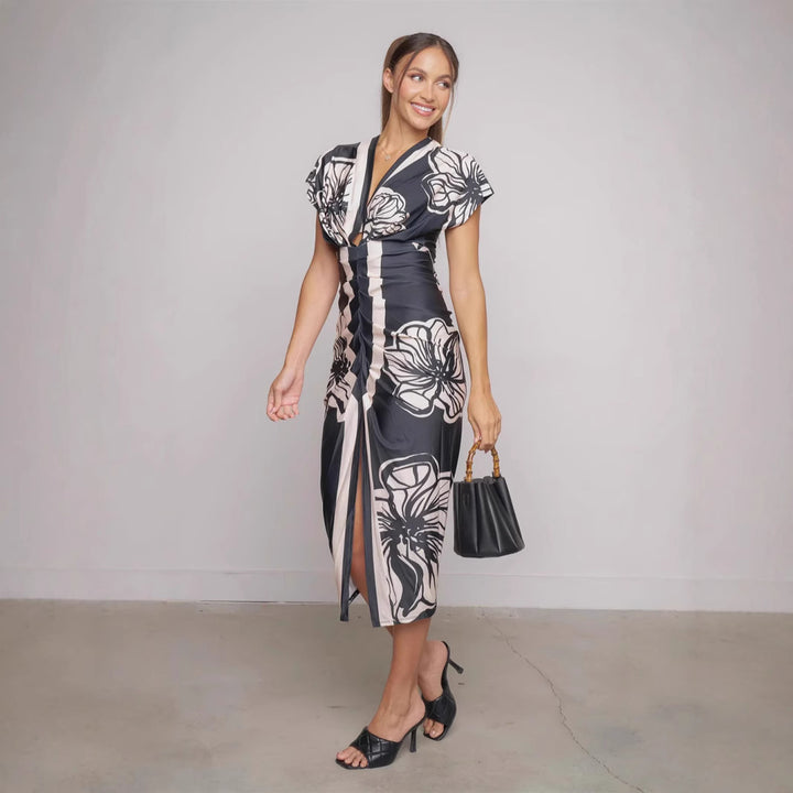 Dame Midi-kjole med blomstret design og elegant split Stilla