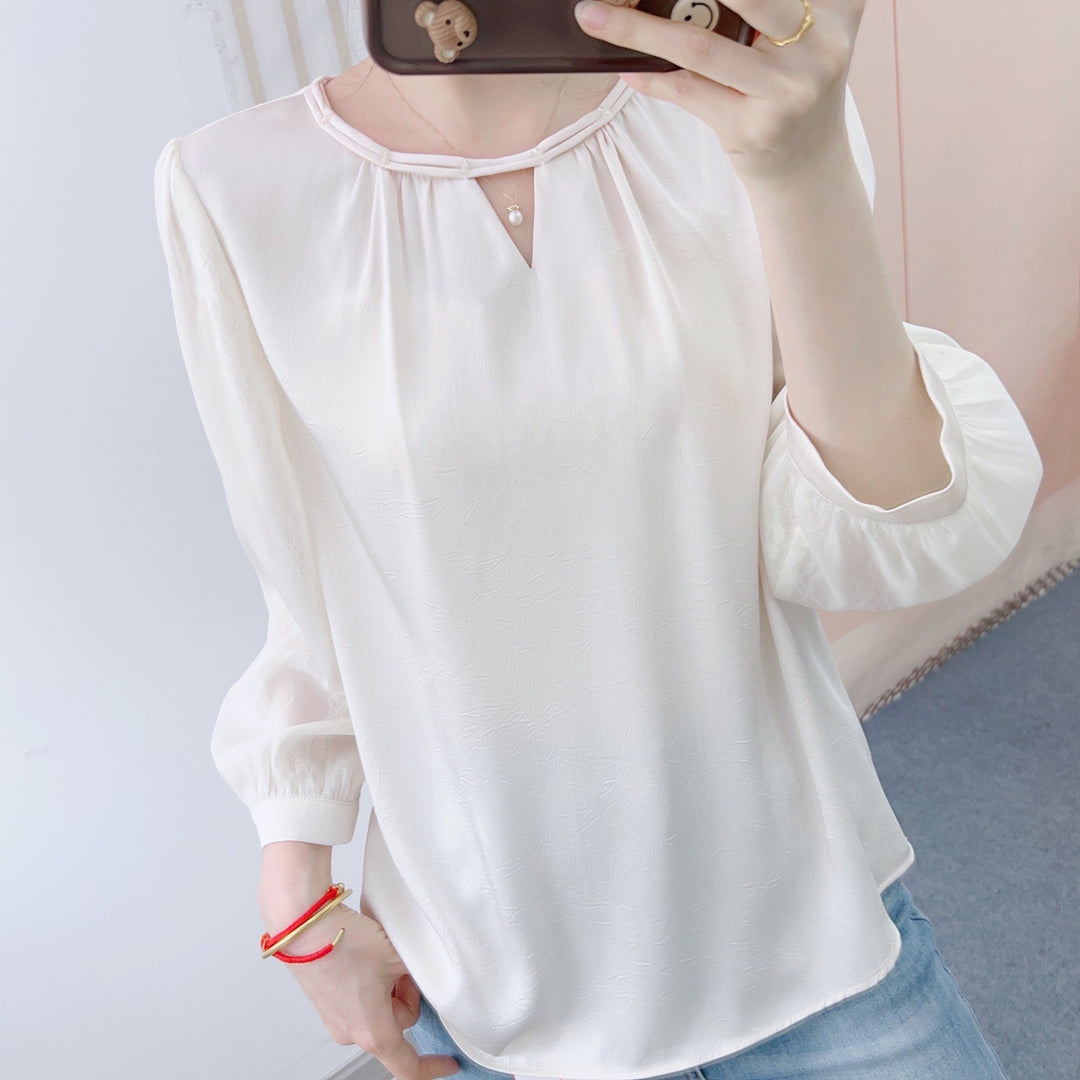 Damebluse med elegant V-halsudskæring og mode puffærmer Stilla