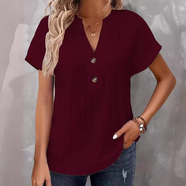 Damebluse med knapdetaljer og struktureret design Stilla