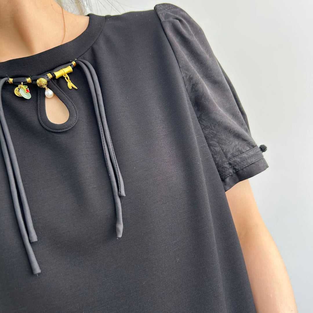Dame Stilet T-shirt med elegant nøgleudskæring og puffærmer Stilla