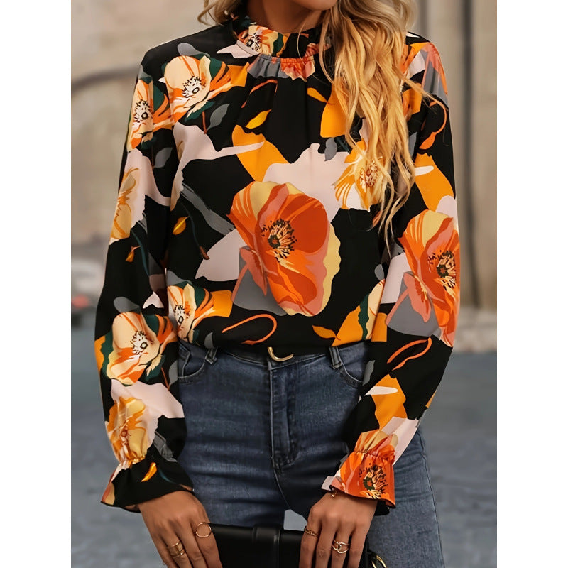 Damebluse med blomsterprint og flæseudskæring i lange ærmer Stilla