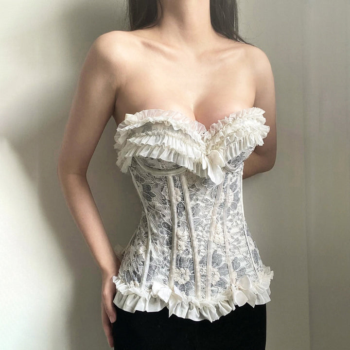 Dame spids-bustier med ruffles detaljer og sløjfer Skovae