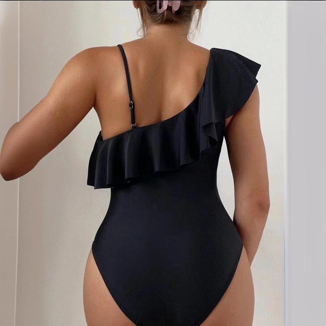 Damer Elegante Badebukser med asymmetrisk flæse-detalje og gennemsigtig indsats Stilla