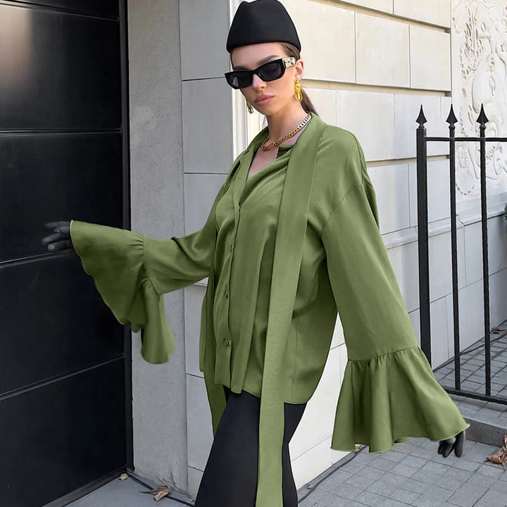 Damebluse med voluminøse ærmer og elegante bindebånd Stilla