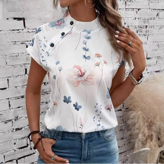 Damebluse med florale accenter og knapdetaljer Stilla