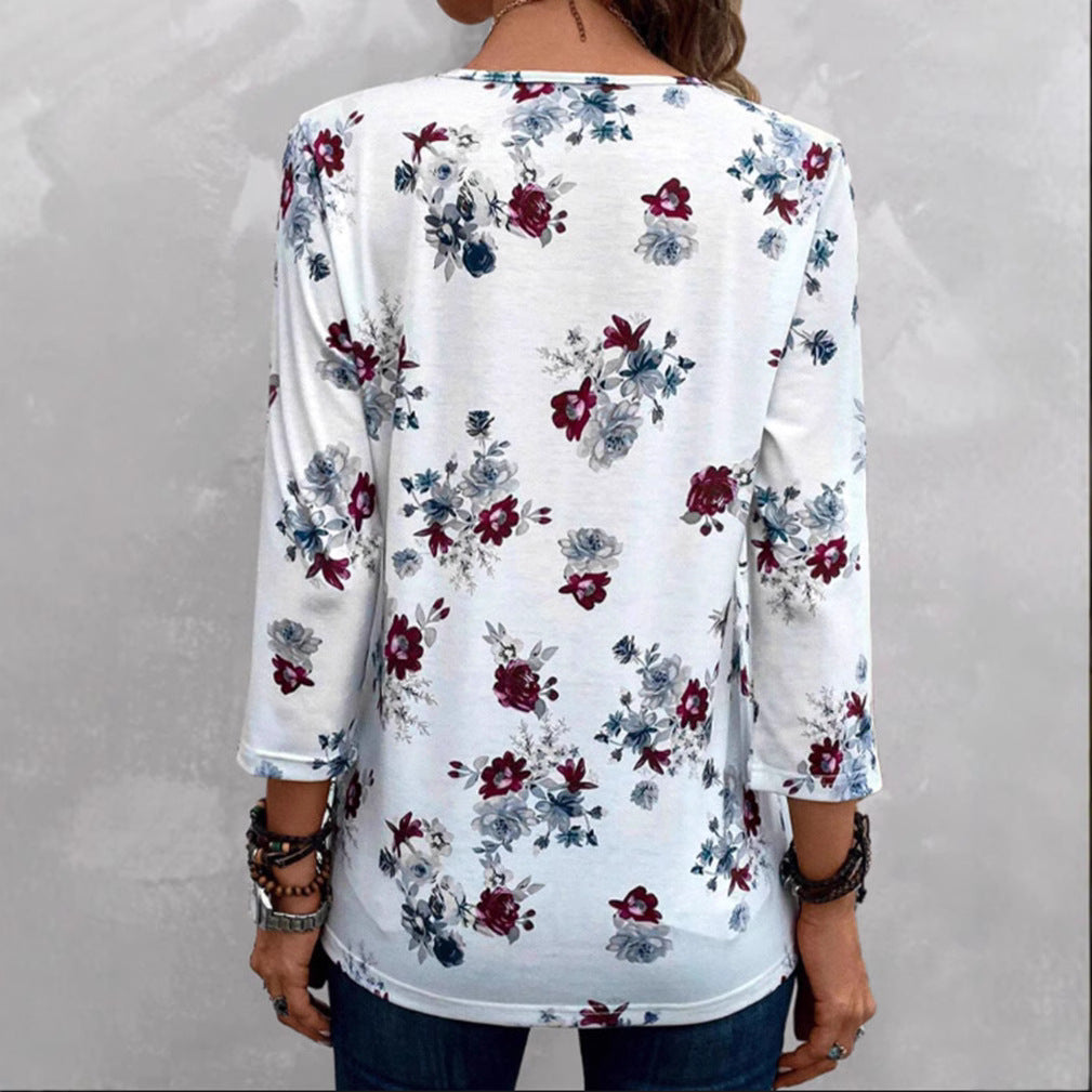 Damebluse med florale accenter og knapper Stilla