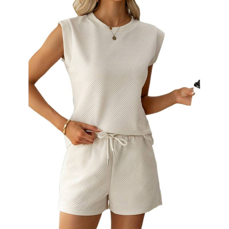 Dame kortærmet jumpsuit med flæse detaljer og bindebælte Skovae