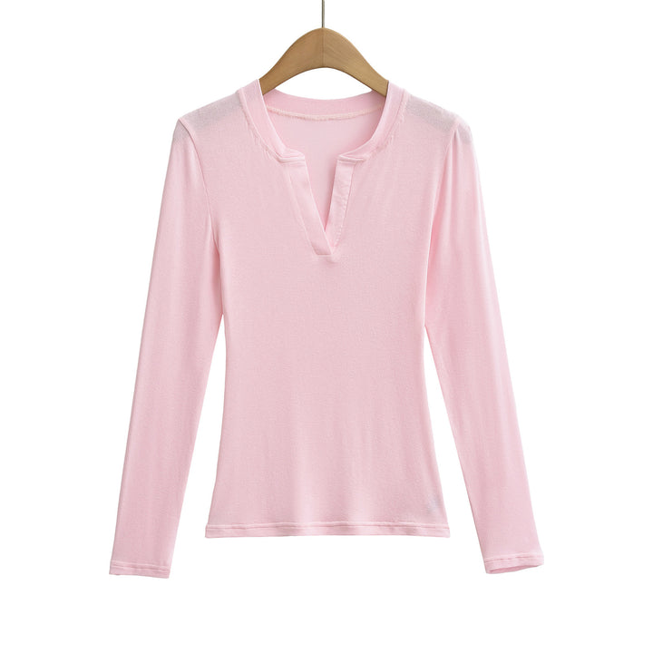 Damer longsleeve top med moderne V-halsudskæring og fin struktur Stilla