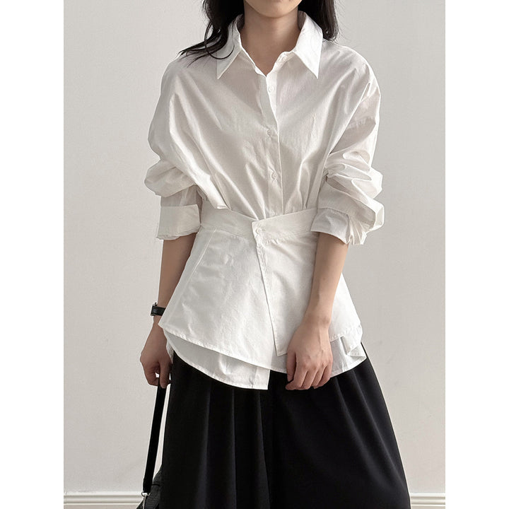 Damebluse med moderne omslagsdesign og elegante pufærmer Stilla