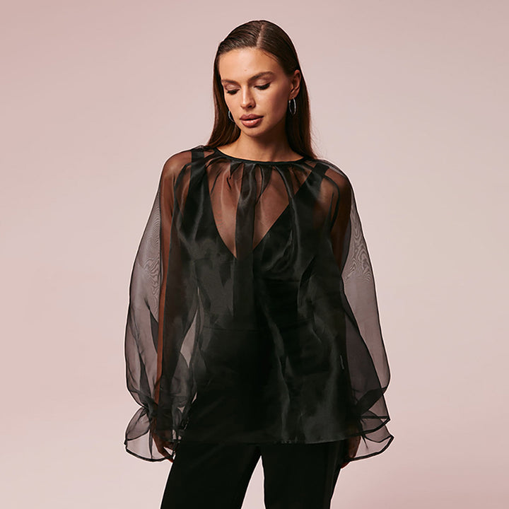 Dame gennemsigtig bluse med voluminøse ærmer og smart design Stilla