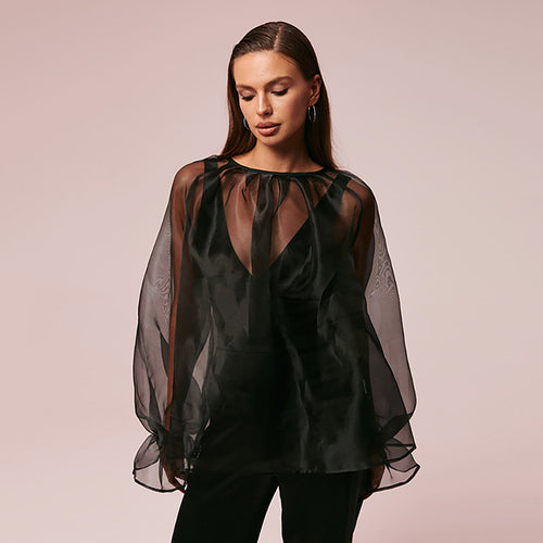 Dame gennemsigtig bluse med voluminøse ærmer og smart design Stilla