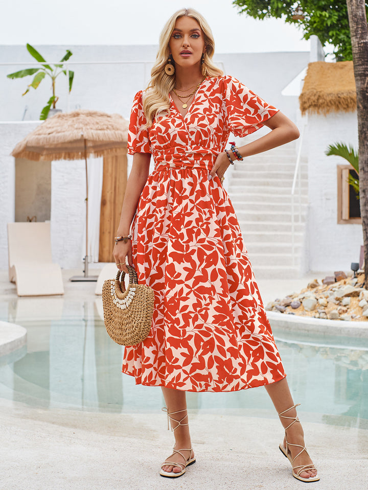 Dame maxikjole med blomstret print og figursyet design Stilla