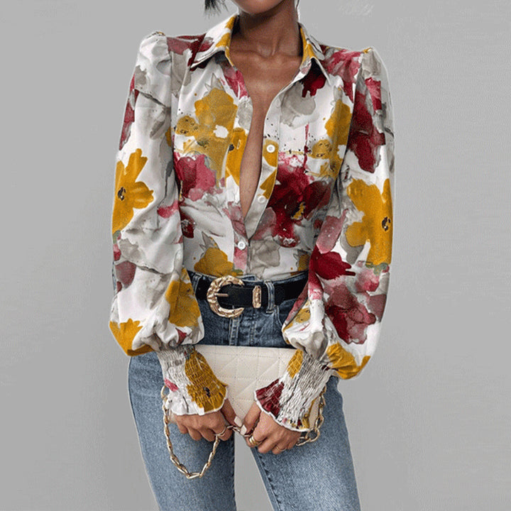 Damebluse med blomstertrykt og puffærmer Stilla